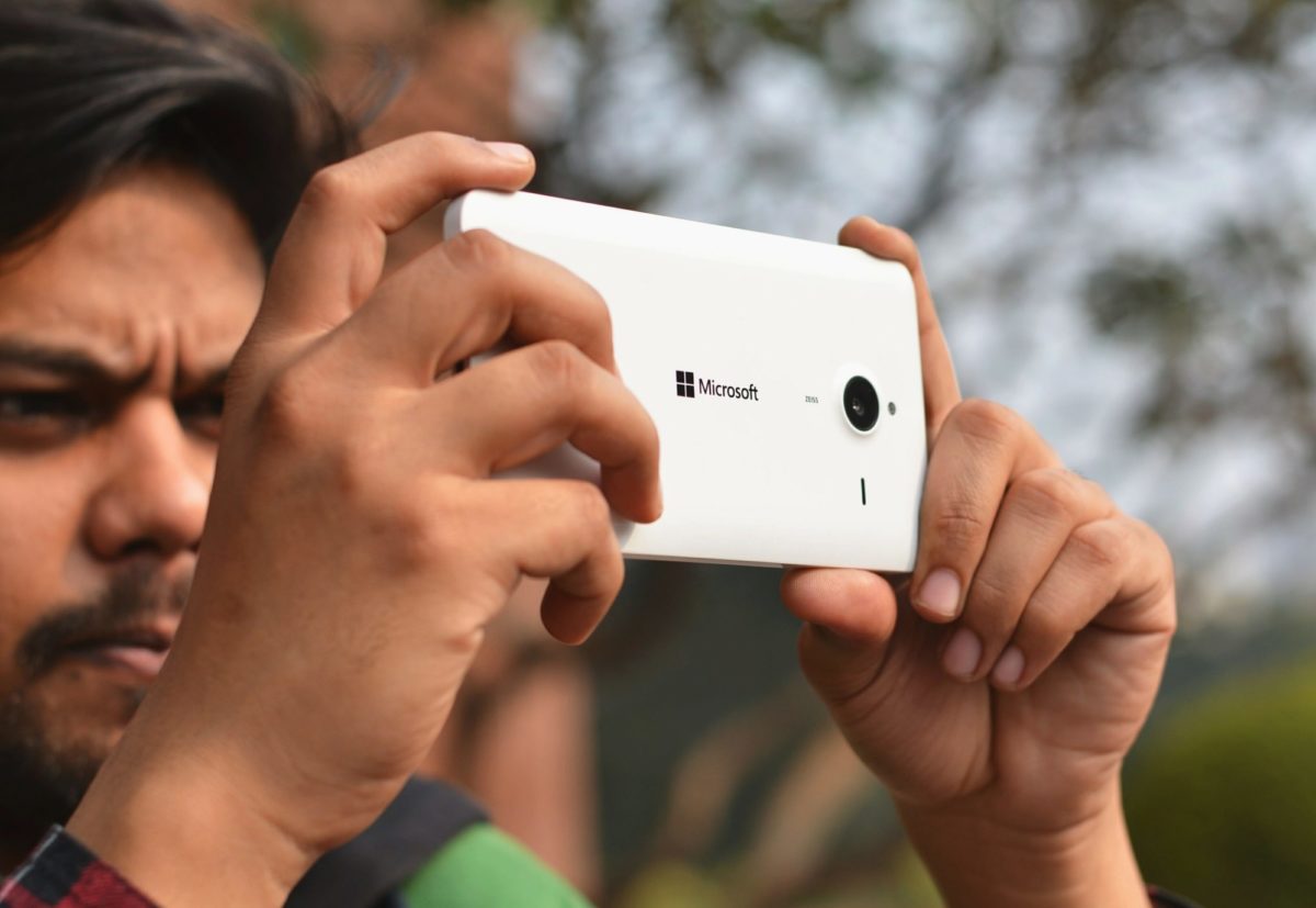 Someone taking a photo with their phone