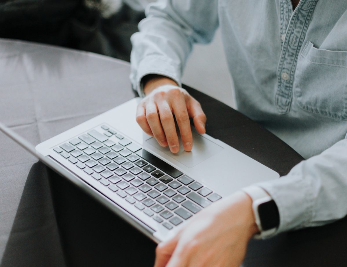 A close up image of someone working on a laptop