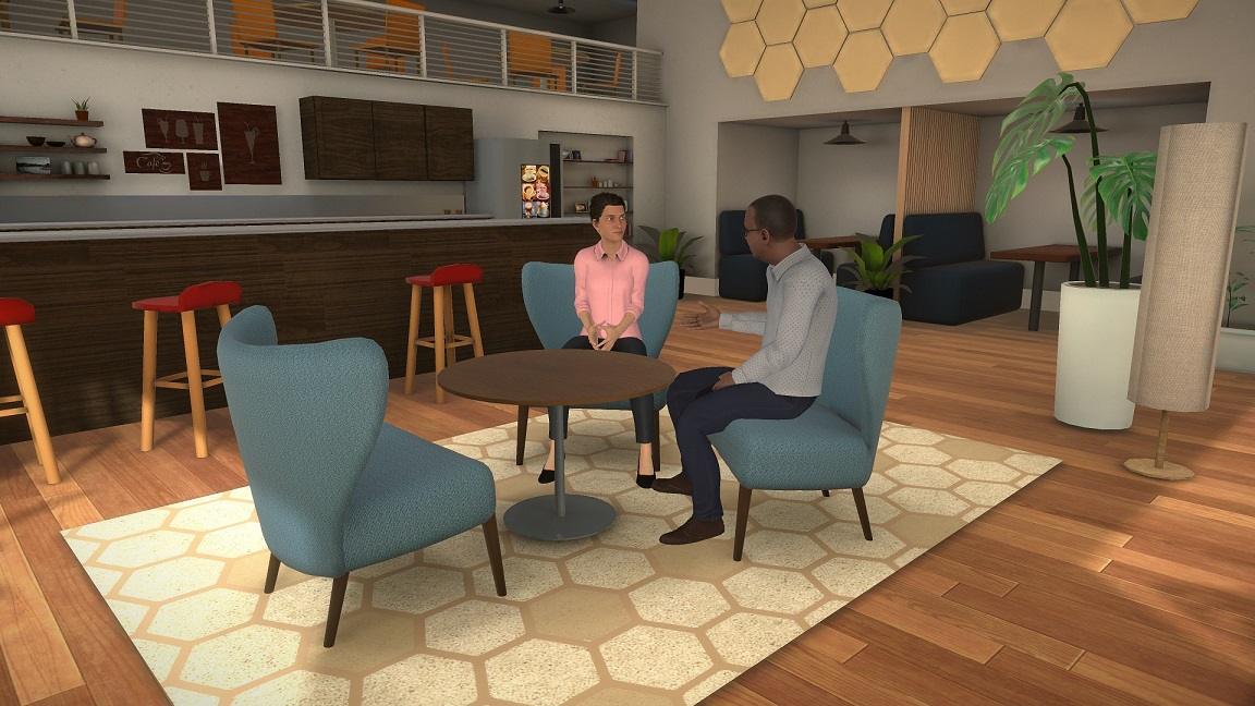 2 people sitting around a table talking